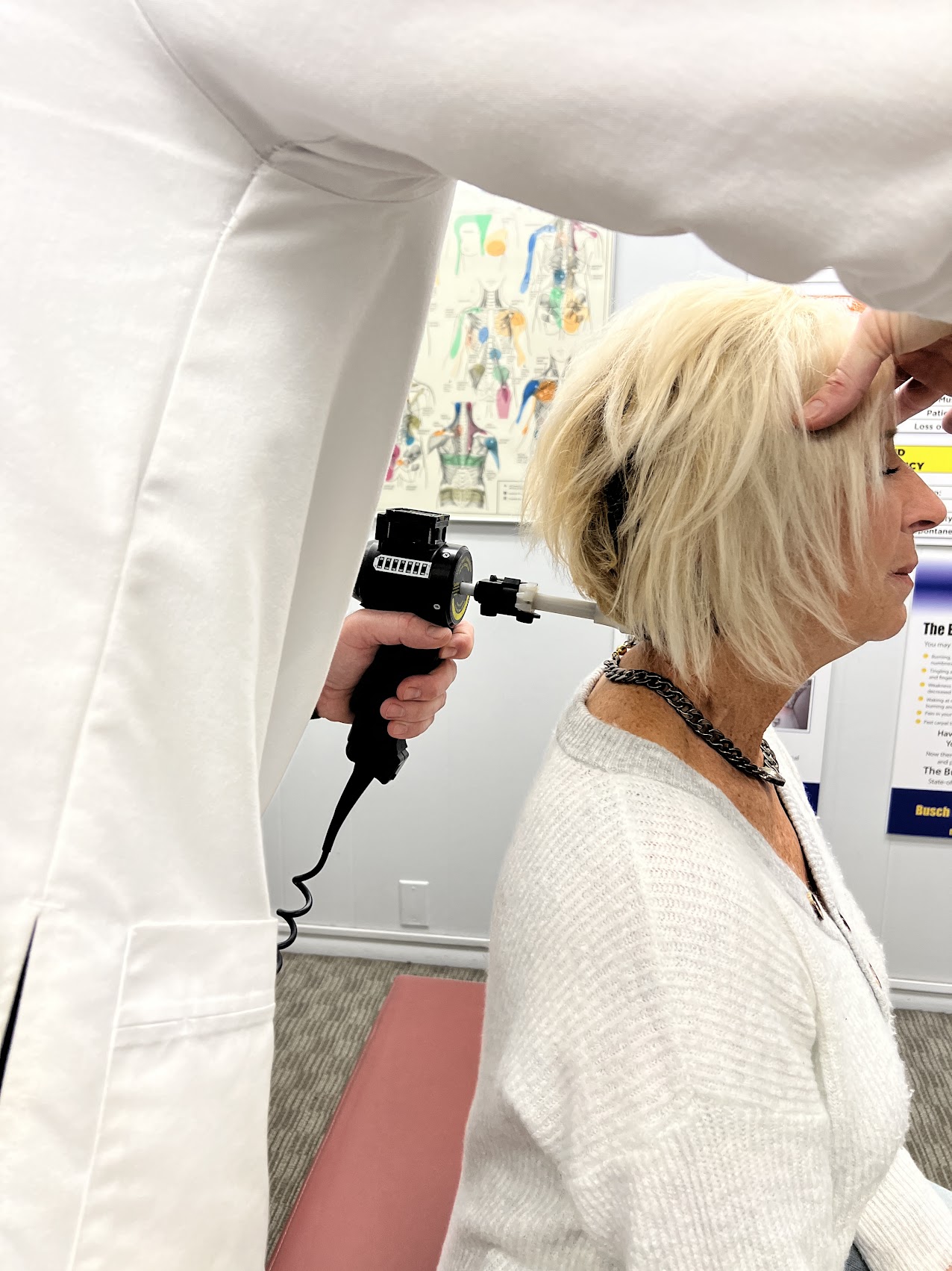 Dr. Busch providing hands-on chiropractic care to a patient